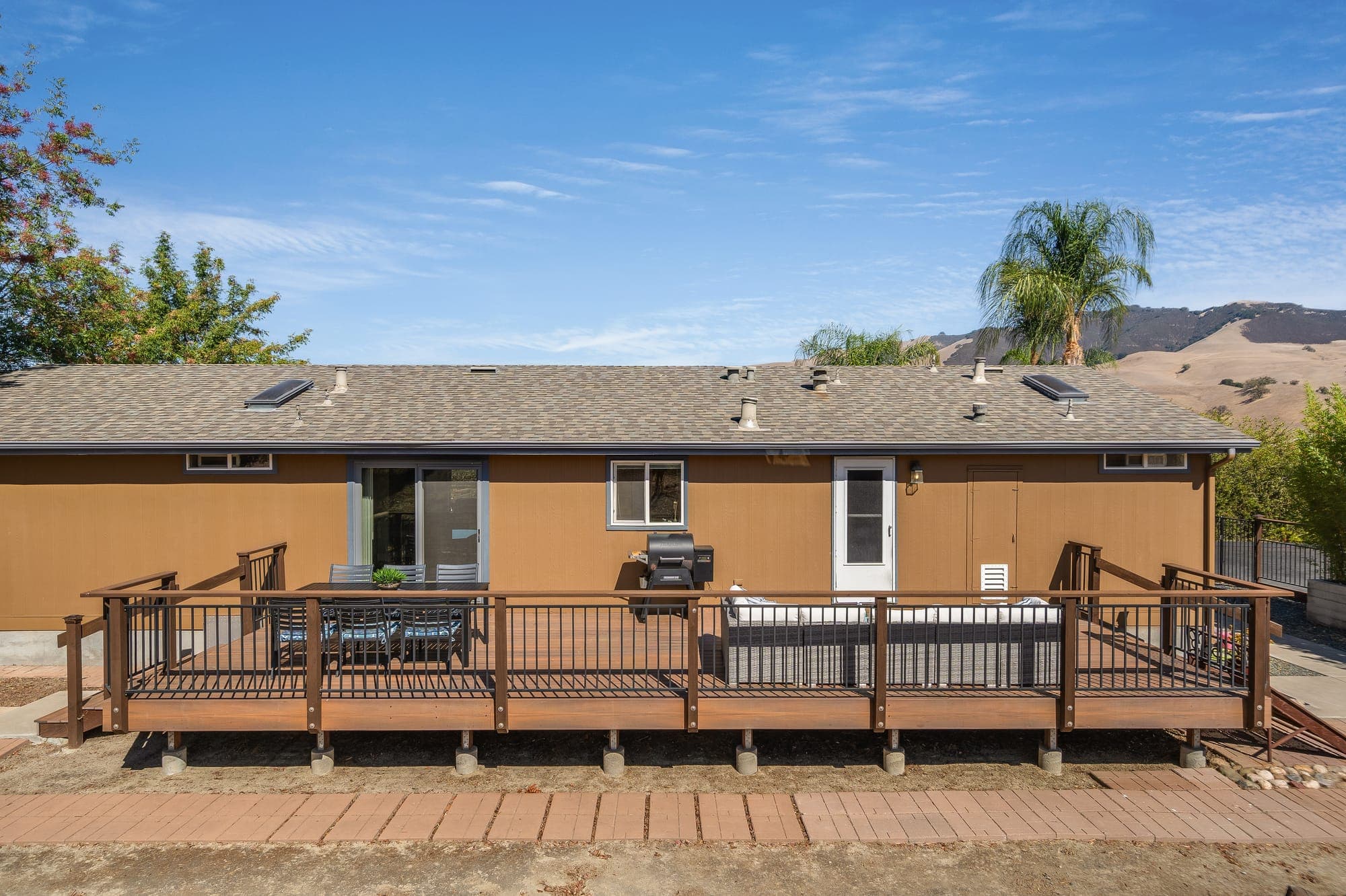 The full length of the rear deck along the back of the residence.